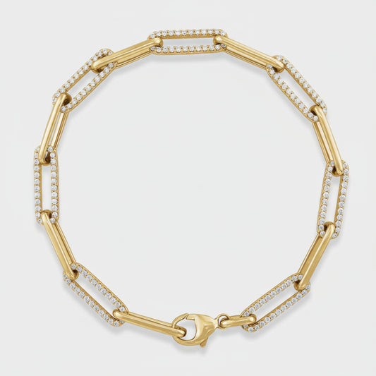 Gold bracelet with diamond accents on a white background