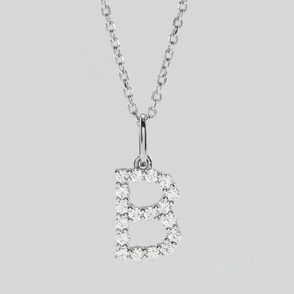 Silver necklace with a letter 'B' pendant on a light gray background