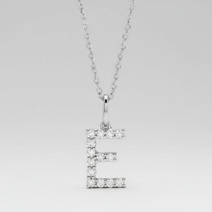 Silver necklace with a letter 'E' pendant on a light gray background