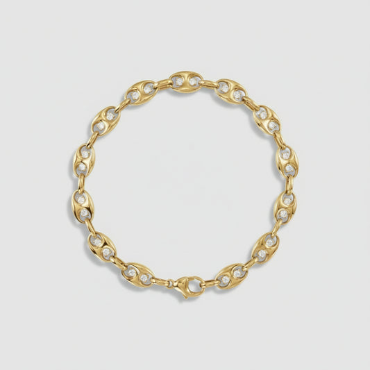 Gold bracelet with embedded with diamonds on a white background